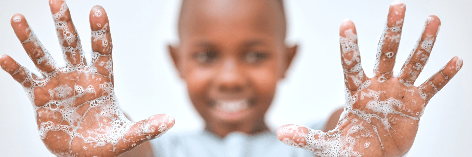 boy showing washed hands