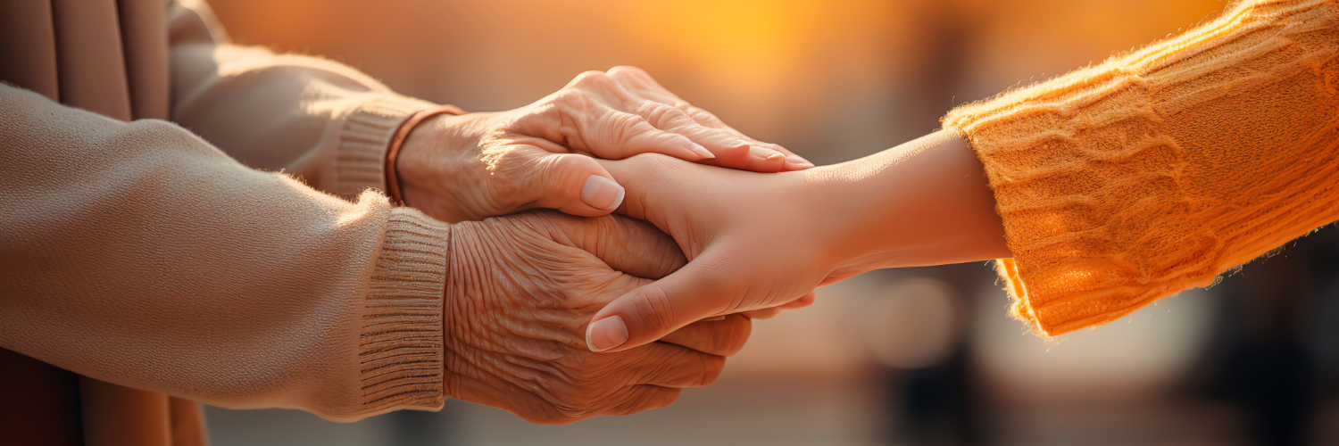 woman holding hand with senior woman