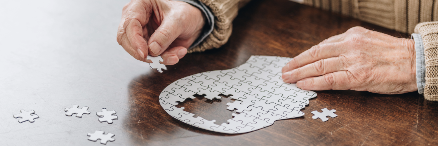 senior man doing puzzle of brain