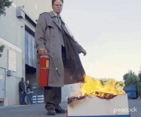 dwight using a fire extinguisher